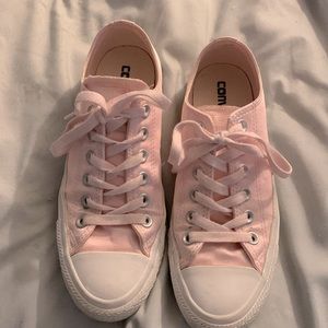 Pale pink satin Converse All Star sneakers.